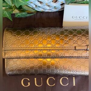 GUCCI GUCCISSIMA Gold Embossed Women's Clutch / Wallet